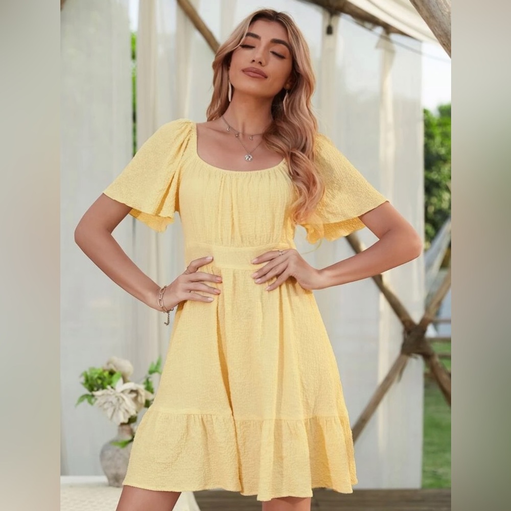 Yellow flouncing mini summers dress. Perfect for any occasion.